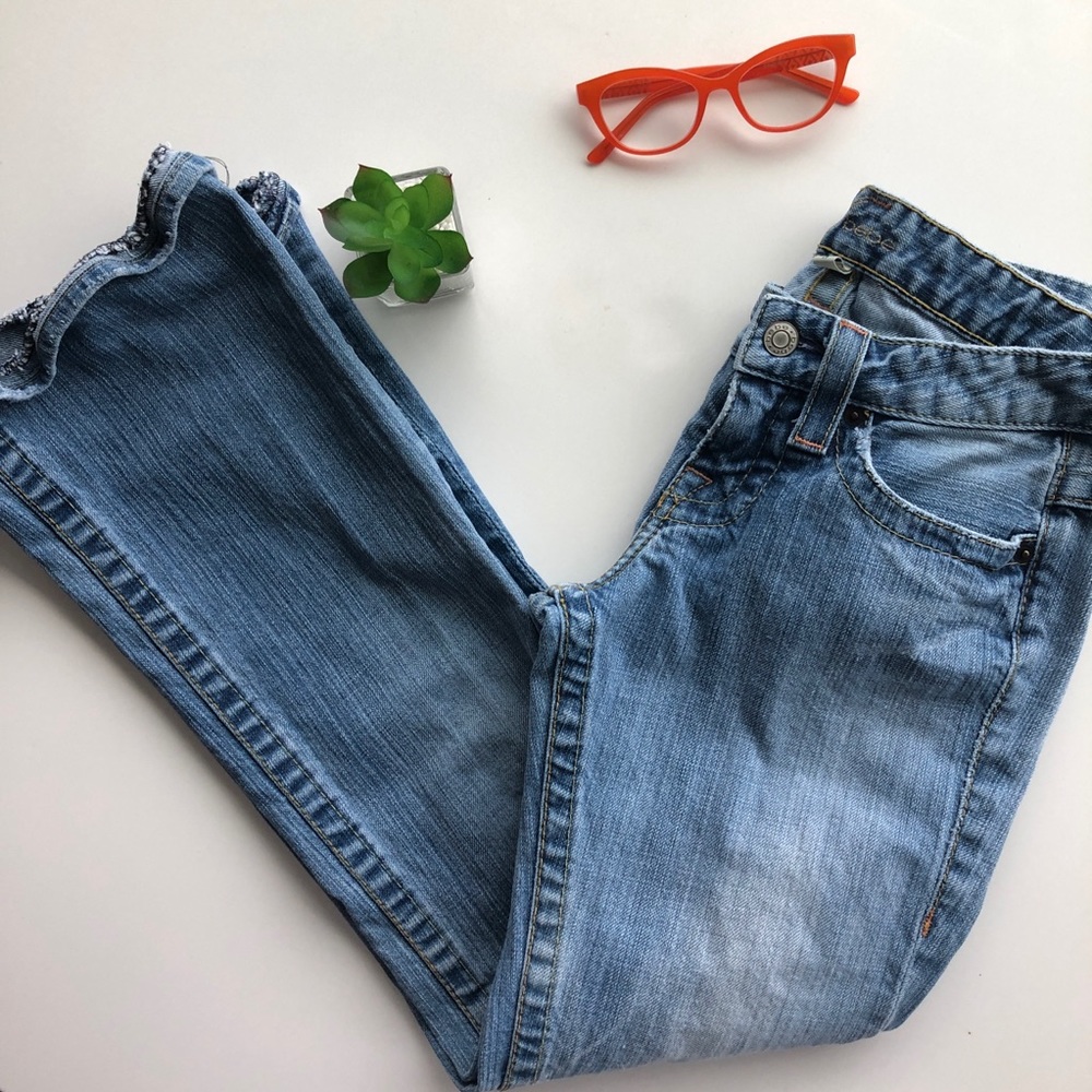 Bebe bootcut low rise jeans blue rhinestone detail on pockets Size 26